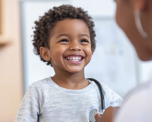 A happy Black child, relaxed and smiling, is having their heartbeat checked by a friendly doctor in a modern, child-centered medical office. The room is filled with warm colors and comforting details that make the visit enjoyable.